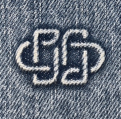 Debossed Simkhai logo, back right pocket